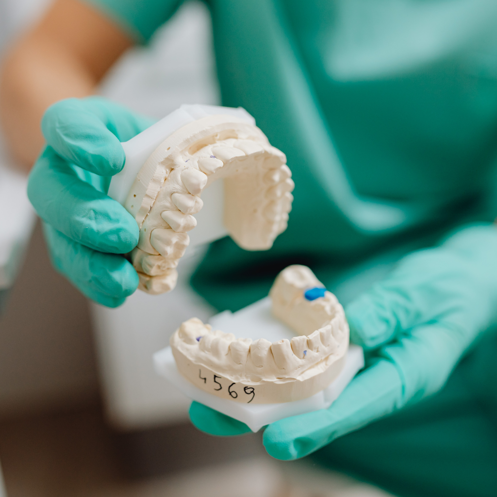 dentist-holding-teeth